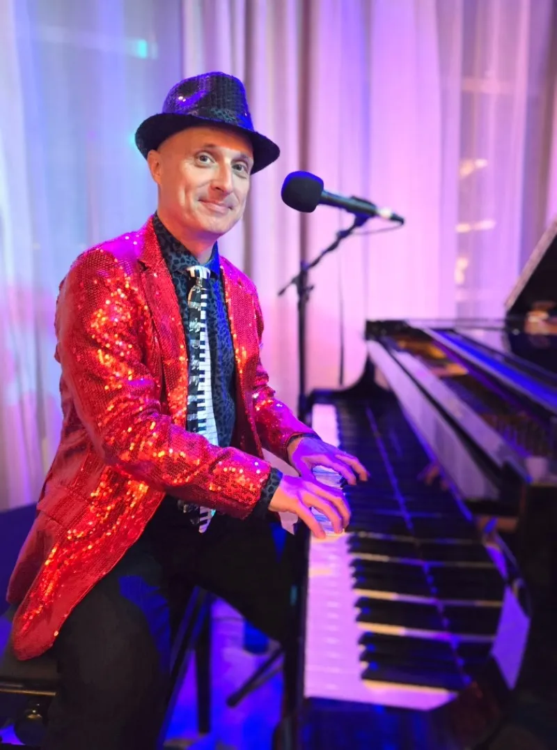 Ed Kelly performing at a private event